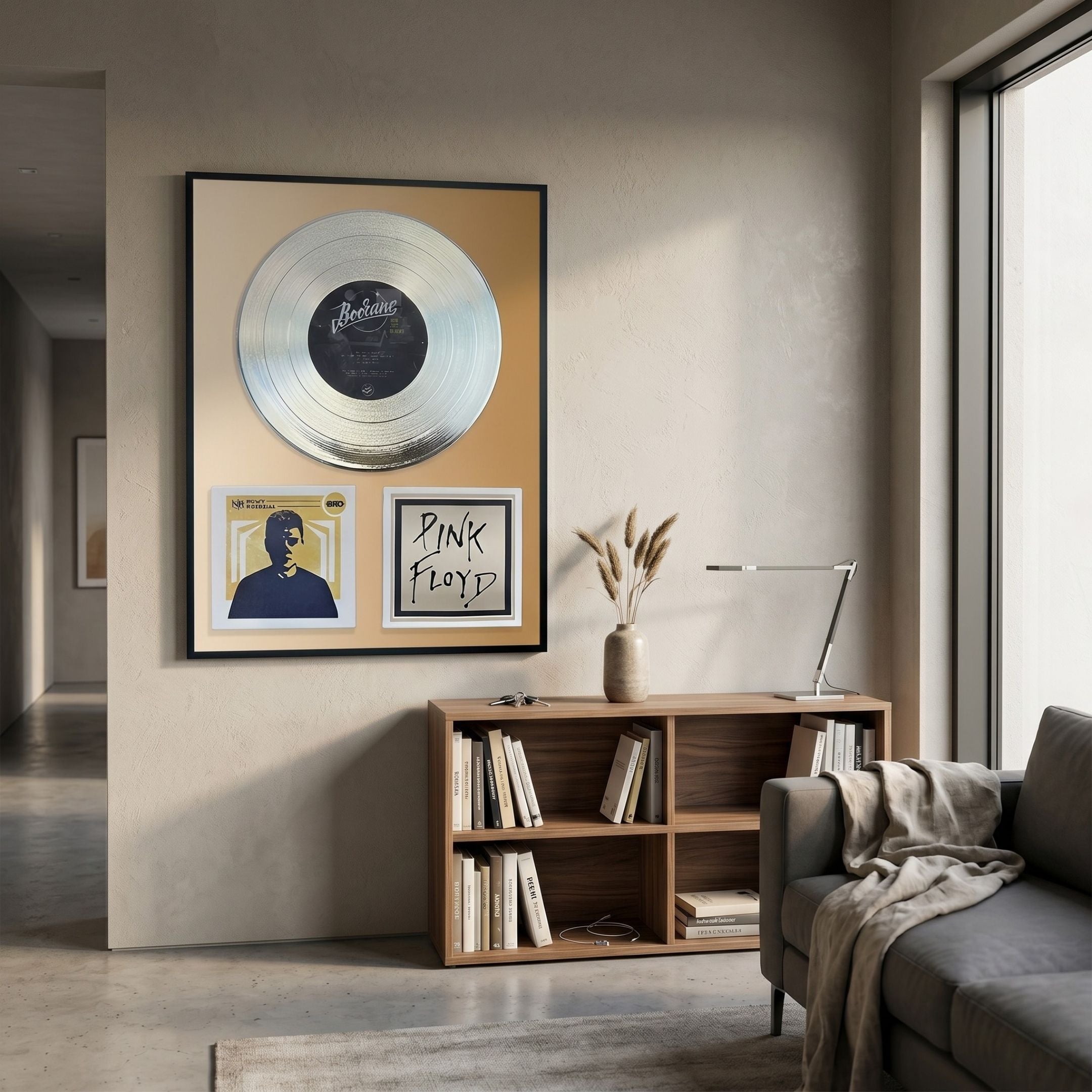 Sonarta Gold Pink Floyd & Bocane Record Tribute Wall Art by Giant Sculptures displayed above a wooden bookshelf in a modern living room.