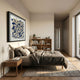 Petalus Blue & Cream Layered Felt 3D Wall Art by Giant Sculptures in a black square frame, displayed above a linen-dressed bed beside an oak bookshelf.
