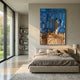Gradalis Blue & Gold Sculptural Metal 3D Wall Art by Giant Sculptures mounted above a low beige bed in a modern bedroom with garden views and bookshelf.