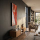 Rivara Ember Wave Vertical Hand-Painted Rope 3D Wall Art by Giant Sculptures displayed on a dark grey wall above a walnut sideboard in a modern living room.