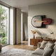 Solvia Grey & Burgundy Layered Geometry 3D Wall Art by Giant Sculptures mounted on a cream wall above a walnut sideboard in a sunlit modern living room.