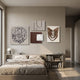 Mirello 4-Set Neutral Sculptural Mixed Media 3D Wall Art by Giant Sculptures arranged above a linen-dressed bed in a neutral bedroom with bookshelves and lamp.
