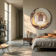 Giant Sculptures Portara Rose Archway Illusion Round 3D Wall Art mounted above a bed, displaying a pink classical corridor within a bronze-gold torn-edge frame.