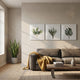 Florvara Botanical Leaves 3-Panel Clear Acrylic 3D Wall Art by Giant Sculptures displayed above a grey sofa in a sunlit Nordic living room with snake plant.