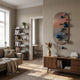 Virellon Rose Gradient 3D Wall Art with blue and silver metal balls mounted on a ribbed oval panel above a walnut sideboard in a living room.
