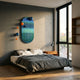 Virellon Blue Gradient 3D Wall Art mounted above a low platform bed, with navy and orange metal balls scattered across the striped panel beside a window.