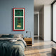 Cavendor Pipe, Torch & Cigar Green Framed Wall Art in red frame displayed on a blue bedroom wall above a wooden nightstand beside a grey bed.