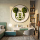 Verdifable Round Green Mouse Silhouette Moss 3D Wall Art mounted above a white desk in a kids' bedroom with bookshelves, collectible figures, and a grey chair.