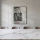Rivarenne Black Abstract Texture Steel Mirror 3D Wall Art by Giant Sculptures displayed in a dining room above a marble table with velvet chairs, showing black relief texture on a reflective steel mirror in a black frame.