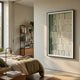 Linara Green & Ivory Stripe Relief 3D Wall Art by Giant Sculptures in a black frame, displayed on a cream bedroom wall beside a bed and bookshelf.