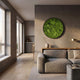 Verdura Round Green Moss Circle 3D Wall Art by Giant Sculptures mounted on a warm grey wall above a wooden console in a modern living room with grey sofa.