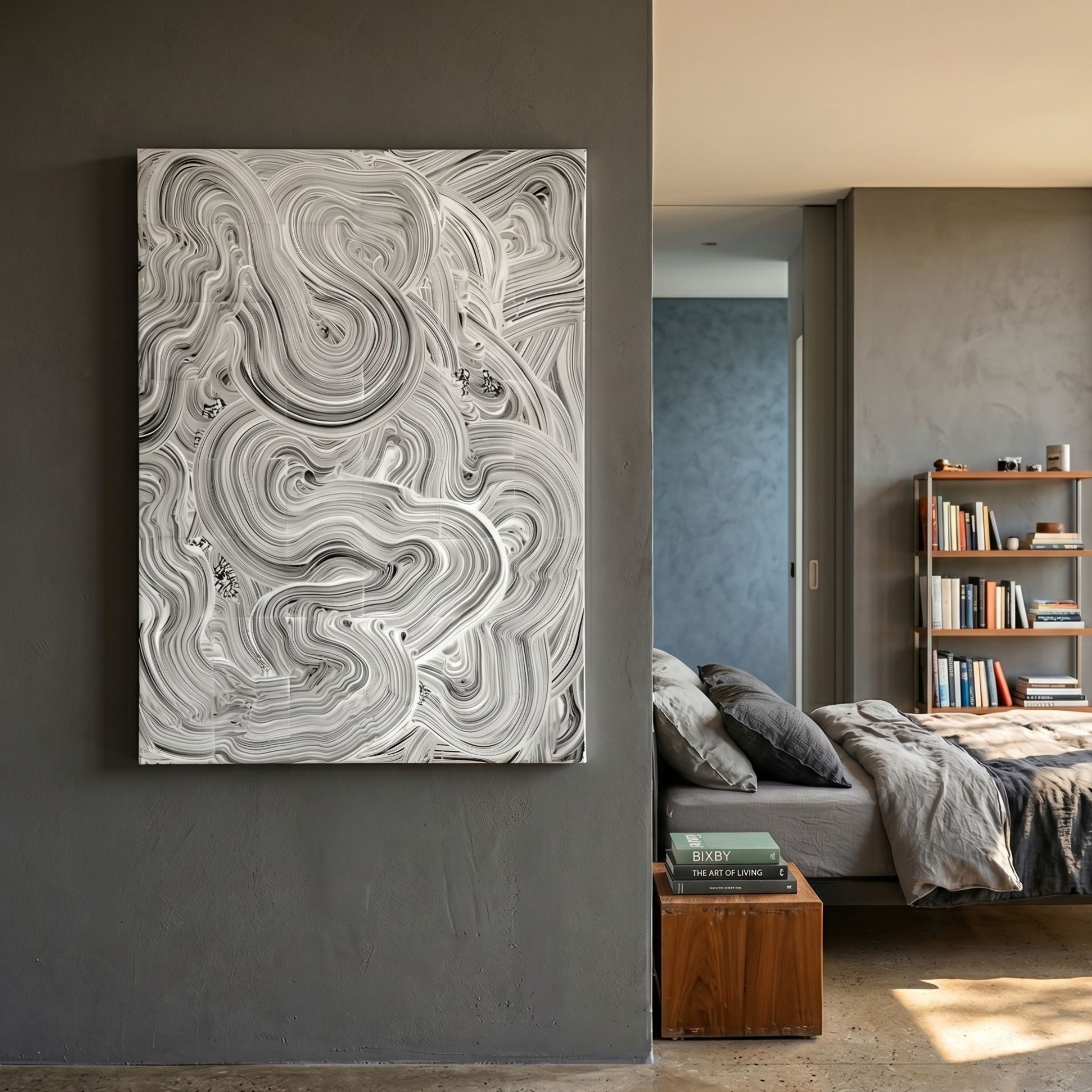 Averis Monochrome Swirl Relief Abstract 3D Wall Art by Giant Sculptures displayed on a dark grey bedroom wall beside a linen bed and wooden bookshelf.