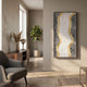 Serrana White & Silver Dual Wave I Vertical 3D Wall Art by Giant Sculptures displayed in a neutral living room beside a wooden sideboard and fiddle leaf plant.