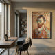 Pixelego Warm Hue Van Gogh Portrait Acrylic Block 3D Wall Art in a dark frame, mounted on a cream wall above a desk with laptop and reading chair.