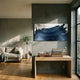 Minara Indigo Twilight Pagoda 3D Button Wall Art by Giant Sculptures displayed above a wooden console table in a sunlit living room with sofa and olive tree.