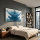 Minara Ice Blue Pagoda 3D Button Wall Art by Giant Sculptures mounted above a wooden bed in a modern grey bedroom with a bookshelf and window.