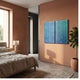 Cirquora Blue II Gradient Ripple Diptych Acrylic 3D Wall Art by Giant Sculptures, mounted on a terracotta bedroom wall beside a bed and fiddle-leaf fig.