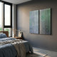 Cirquora Green II Gradient Ripple Diptych Acrylic 3D Wall Art by Giant Sculptures mounted on a grey bedroom wall beside a window and bed with blue linen.
