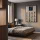 Iconivault Superhero Grid With Spiderverse 3D Wall Art mounted on a grey bedroom wall above a wooden platform bed, lamp, and nightstand.