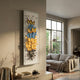 Papillora Blue & Yellow Gradient Butterfly Acrylic 3D Wall Art by Giant Sculptures mounted on a beige living room wall beside a large window and grey sofa.