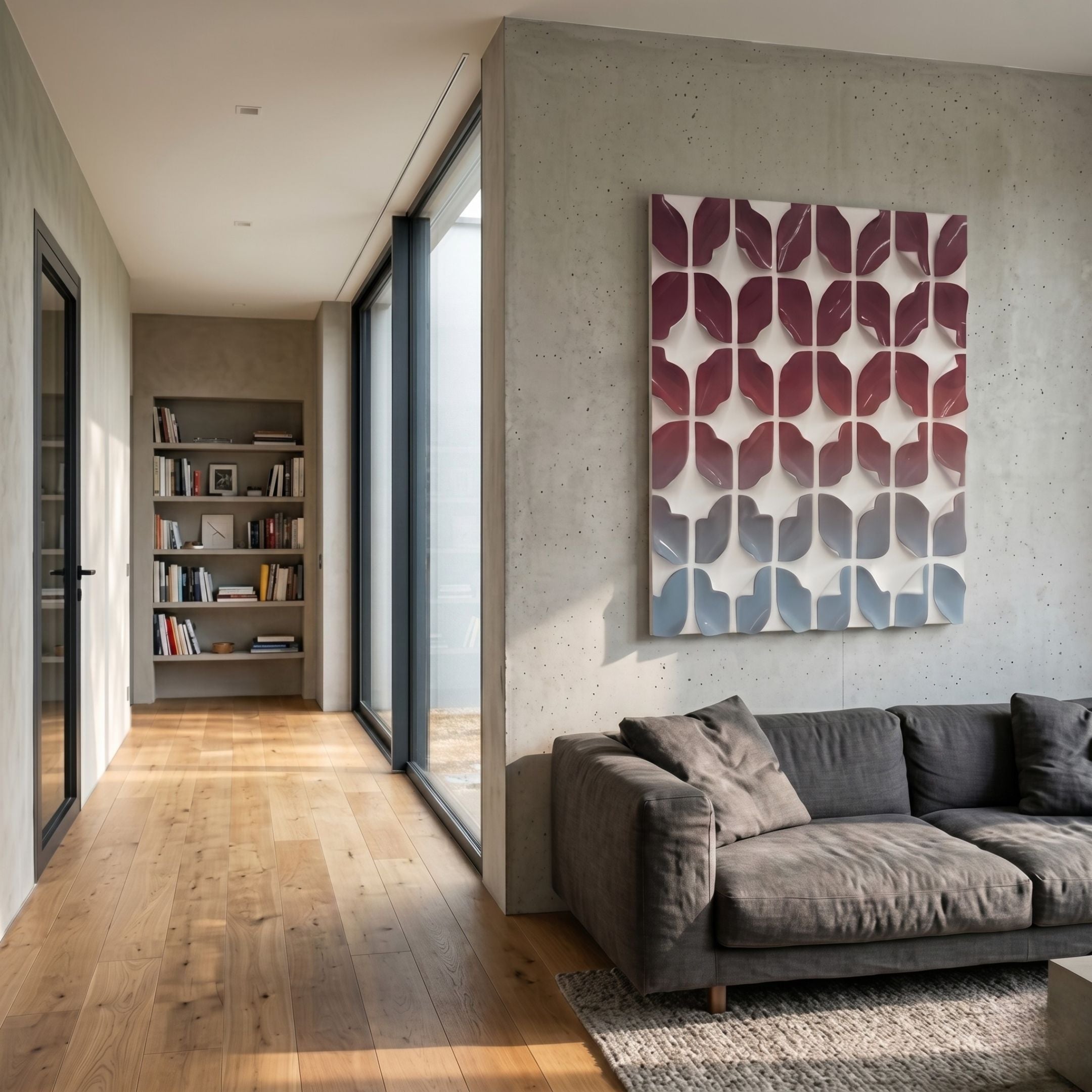 Foliora Crimson & Ice Blue Grid Leaf Acrylic 3D Wall Art by Giant Sculptures mounted on a concrete wall above a grey sofa in a modern living room.