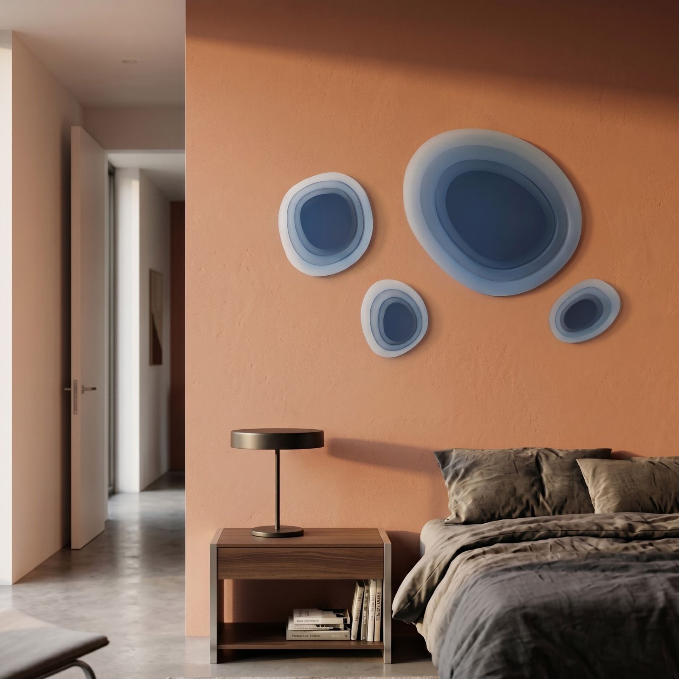 Nuvora Blue Gradient Cluster 3D Acrylic Wall Art by Giant Sculptures displayed on a terracotta bedroom wall above a walnut nightstand and grey-linen bed.
