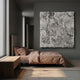 Auralith White Layered Leather 3D Wall Art mounted above a brown-linen bed in a modern grey bedroom with wood bench and concrete floor.