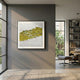 Fractura Sunlit Yellow Square 3D Acrylic Wall Art by Giant Sculptures displayed on a grey wall in a modern interior with an Eames lounge chair and bookshelf.