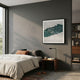 Fractura Emerald Green Square 3D Acrylic Wall Art by Giant Sculptures displayed above a wooden nightstand in a grey-walled modern bedroom with bookshelf.