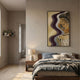 Veridra Spiral Stair II Acrylic & Metal 3D Wall Art by Giant Sculptures with wavy purple, gray and gold layers above a wooden bed and nightstand in a neutral bedroom.