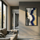 Veridra Black & Gold Flow Acrylic 3D Wall Art by Giant Sculptures mounted on a grey hallway wall above a linen sofa, with navy, beige, black, white, and gold waves.