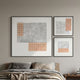 Terracube 3-Set Hand-Painted Framed Acrylic 3D Wall Art by Giant Sculptures hung above a bed, featuring grey textured panels with peach cube grids in black frames.
