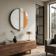 Meridra Orange Crescent & White Marble Circular 3D Wall Art by Giant Sculptures displayed above a walnut sideboard with brass lamp and black vase in a modern living room.