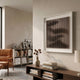 Linscend Brown Ripple Slatted Acrylic 3D Wall Art by Giant Sculptures displayed above a dark wood console in a neutral living room with leather armchair and bookshelf.