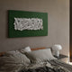 Stravira Green I Sculptural White Metal 3D Wall Art by Giant Sculptures, mounted above a linen-dressed bed with a mushroom lamp on a black side table.