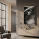 Flutara Smoke Muse Folded Acrylic 3D Wall Art displayed above a cream sideboard in a warm taupe living room with armchair and tall window nearby.