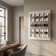 Valdris Bronze & Black Circle Panel Acrylic 3D Wall Art by Giant Sculptures displayed on a cream wall in a modern office beside a walnut desk and window.