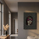 Pixelade Pink Lens Girl Acrylic Dot 3D Wall Art by Giant Sculptures displayed on a grey hallway wall beside a console with pampas grass and a bedroom doorway.