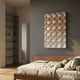 Lucentra Amber Gradient Grid Acrylic 3D Wall Art by Giant Sculptures displayed above a walnut bed in a grey-walled bedroom with built-in shelving.