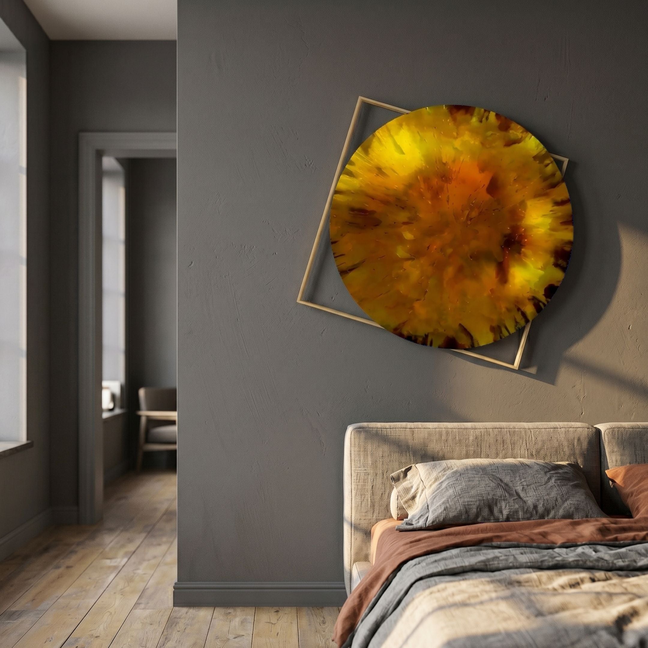 Aurenza Amber Acrylic & Metal Frame 3D Wall Art by Giant Sculptures, a tilted gold square frame with amber burst, on a grey bedroom wall above a linen bed.