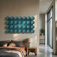 Orbessa Teal Bubble Grid Linear Acrylic 3D Wall Art mounted above a bed with rust and grey linens, beside a wooden nightstand and lamp in a modern bedroom.