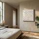 Frondra White Layered Leather 3D Wall Art displayed on a beige plaster wall in a Nordic bedroom with linen bedding, oak flooring, and a monstera plant.