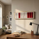 Striara White & Crimson Flow Stripe Acrylic 3D Wall Art by Giant Sculptures with rippled white and red panels in a slim gold frame, displayed above a desk.