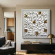 Lucida Gold & White Acrylic Square 3D Wall Art mounted above a dark sideboard with brass lamp in a modern living room beside a grey armchair.