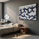 Scalara Navy & White Acrylic 3D Wall Art by Giant Sculptures displayed above a wooden nightstand in a modern grey bedroom with a linen bed and desk.