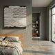 Textura Sculptural Plaster Ridges 3D Wall Art by Giant Sculptures displayed above an oak bed in a sage-green bedroom with linen bedding and a hallway bookshelf.