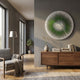 Lustara Green Gradient Circular Leather 3D Wall Art mounted on a grey wall above a walnut sideboard in a modern living room with armchair and floor lamp.