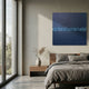 Cryolume Midnight Blue Crystal Inlay 3D Wall Art mounted above a wooden nightstand in a modern bedroom with grey linen bedding and a pampas grass vase.