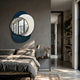 Solistra Azure I Layered Round Mirror 3D Wall Art by Giant Sculptures mounted above a grey linen bed with a brass lamp and nightstand in a modern bedroom.