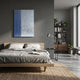 Metallure Blue Linear Textured Acrylic Silver Foil 3D Wall Art by Giant Sculptures displayed above a wooden bed in a modern grey bedroom with bookshelf.